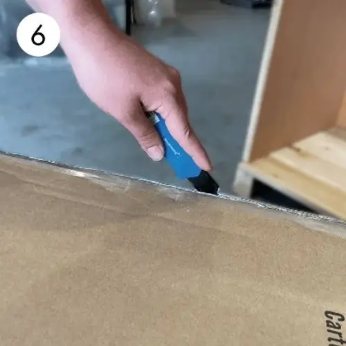 Step 6: Carefully remove wrapping and tape from the export packaging.