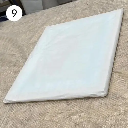 Step 9: Remove acid-free tissue paper from the painting.